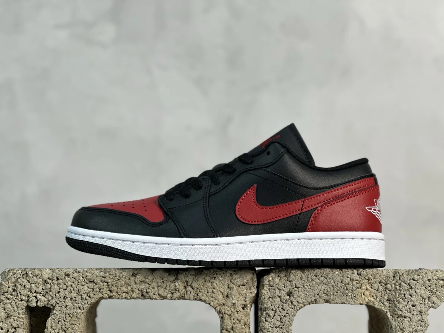 . Air Jordan 1 Low – Black & Red Heritage Sneakers