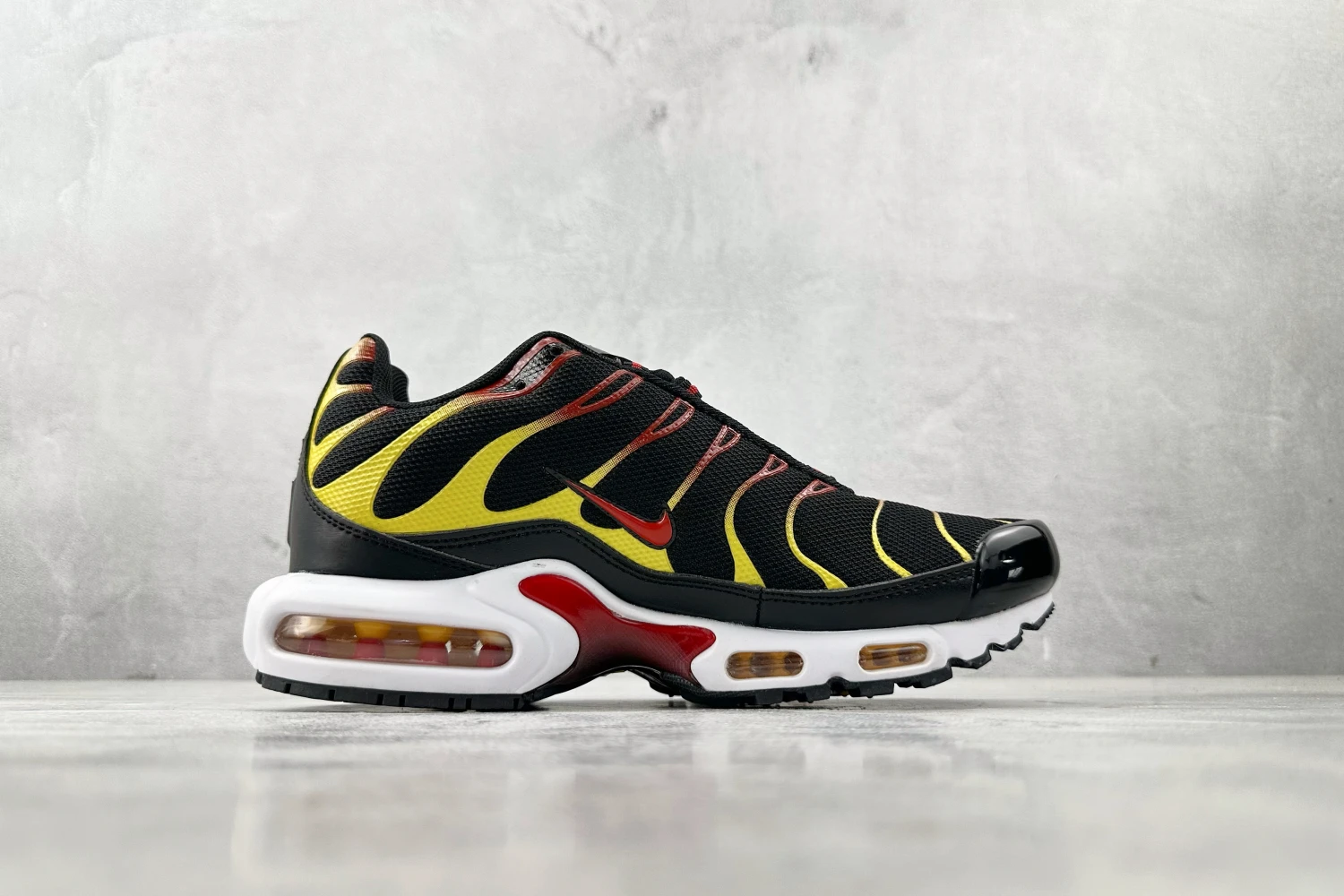 Nike Air Max Plus TN Black Yellow Red Gradient Sneakers
