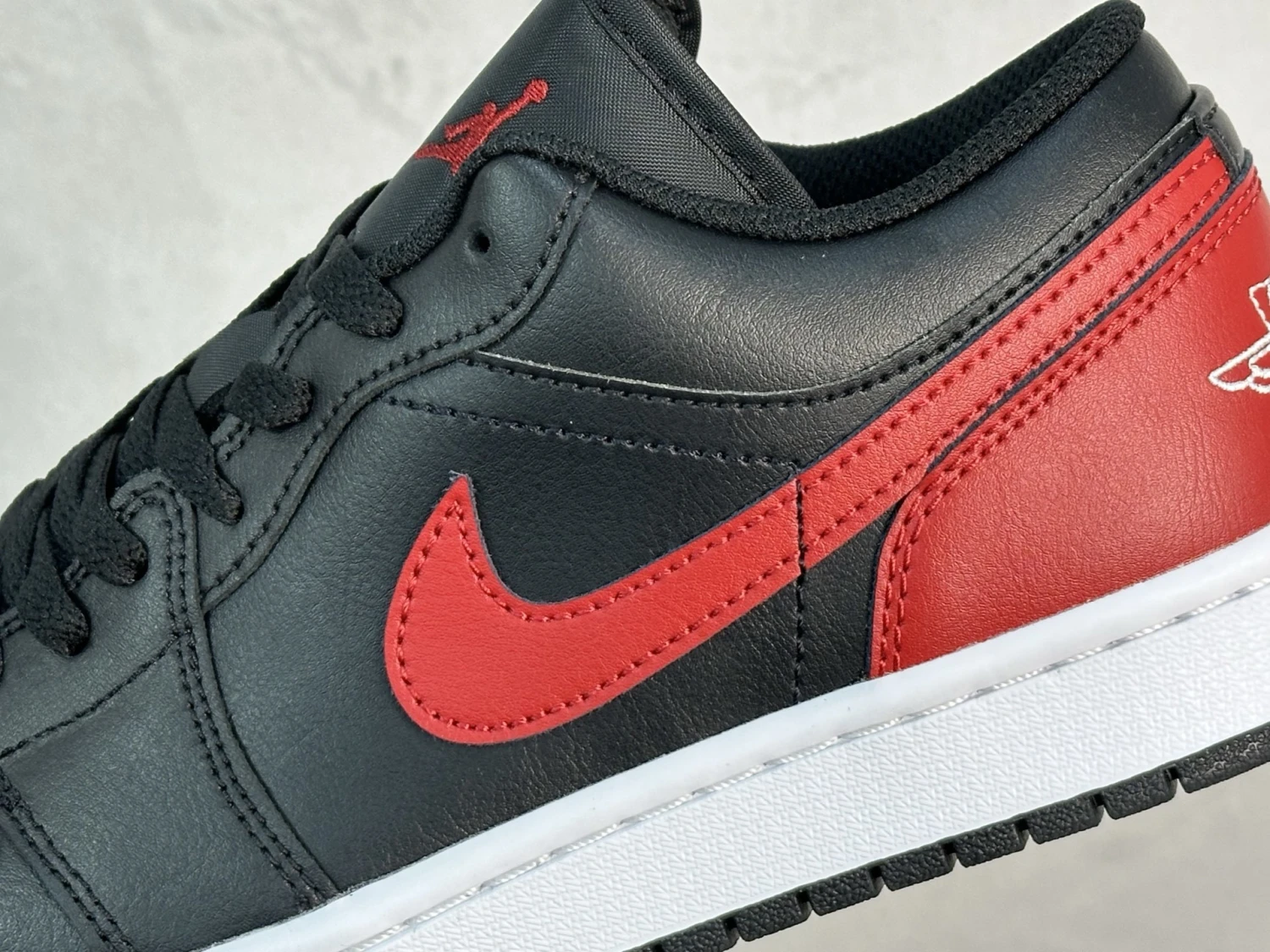 . Air Jordan 1 Low – Black & Red Heritage Sneakers