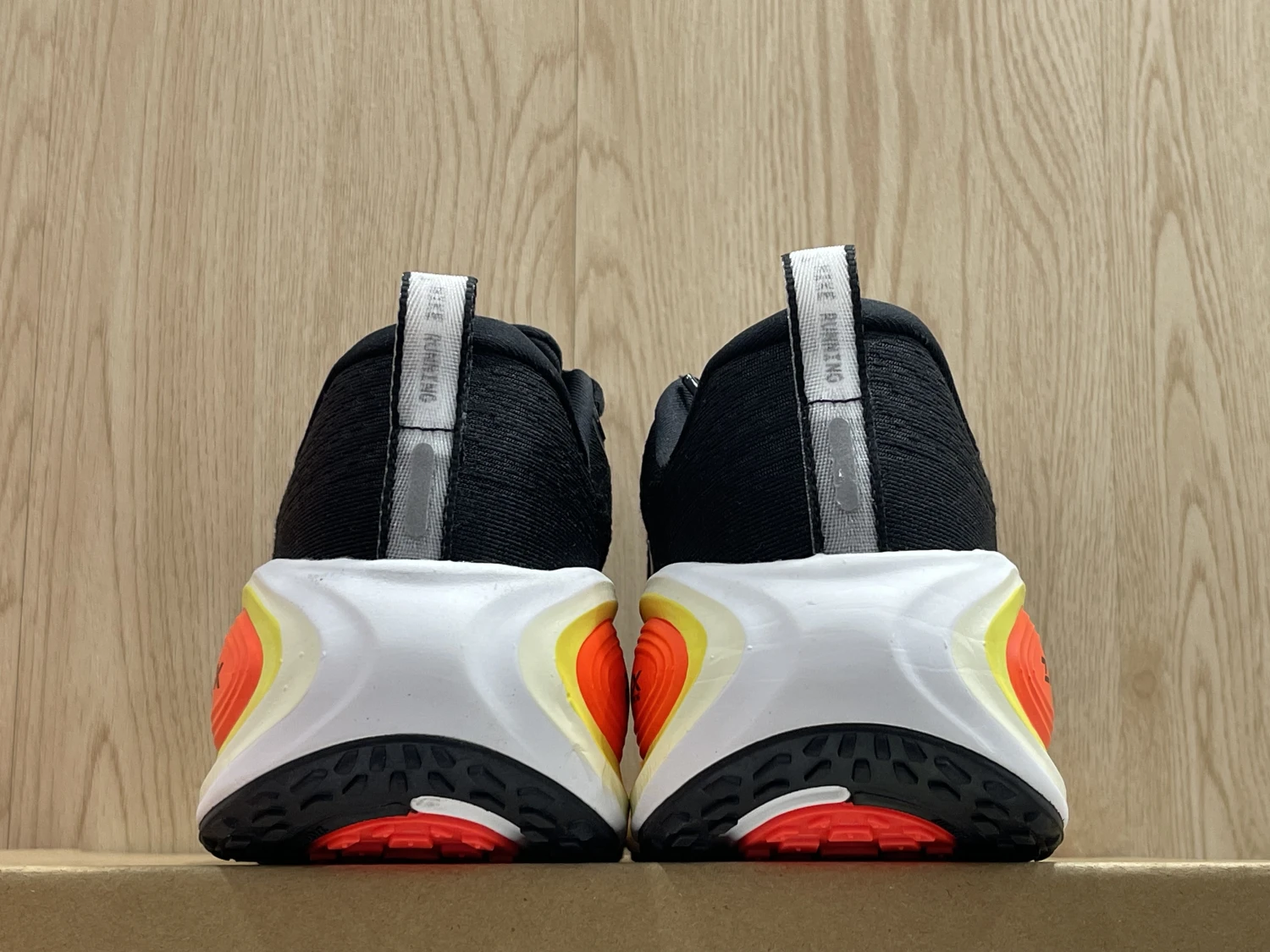 Nike Run Vomero Plus – Black / White / Safety Orange