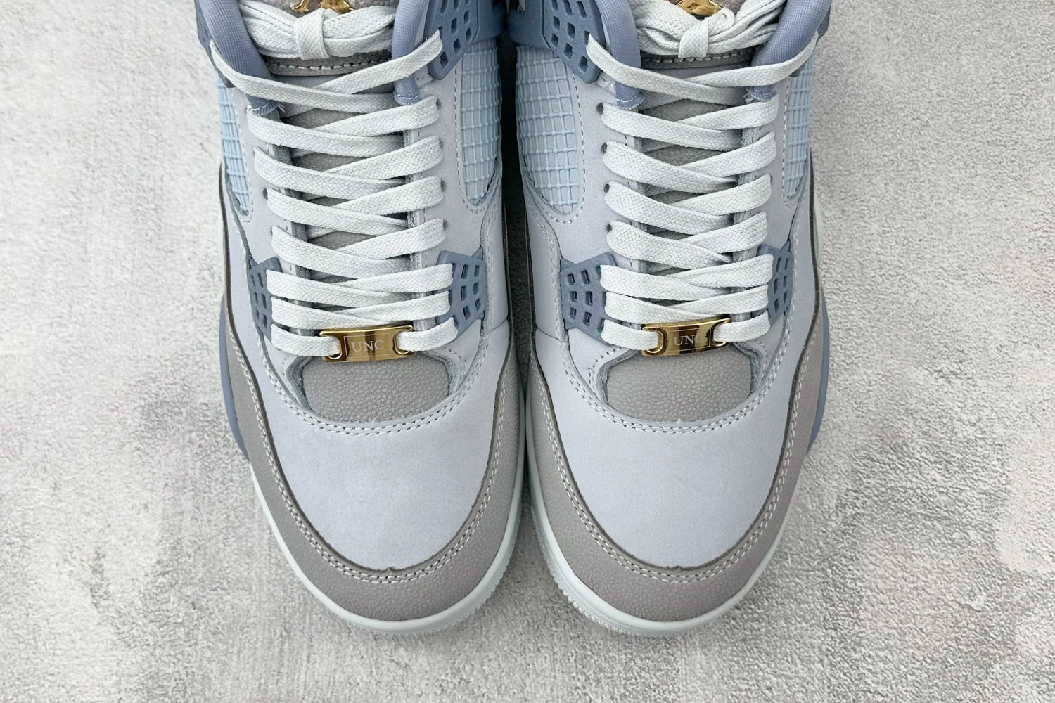 Air Jordan 4 Retro Sneakers – Ice Blue Edition